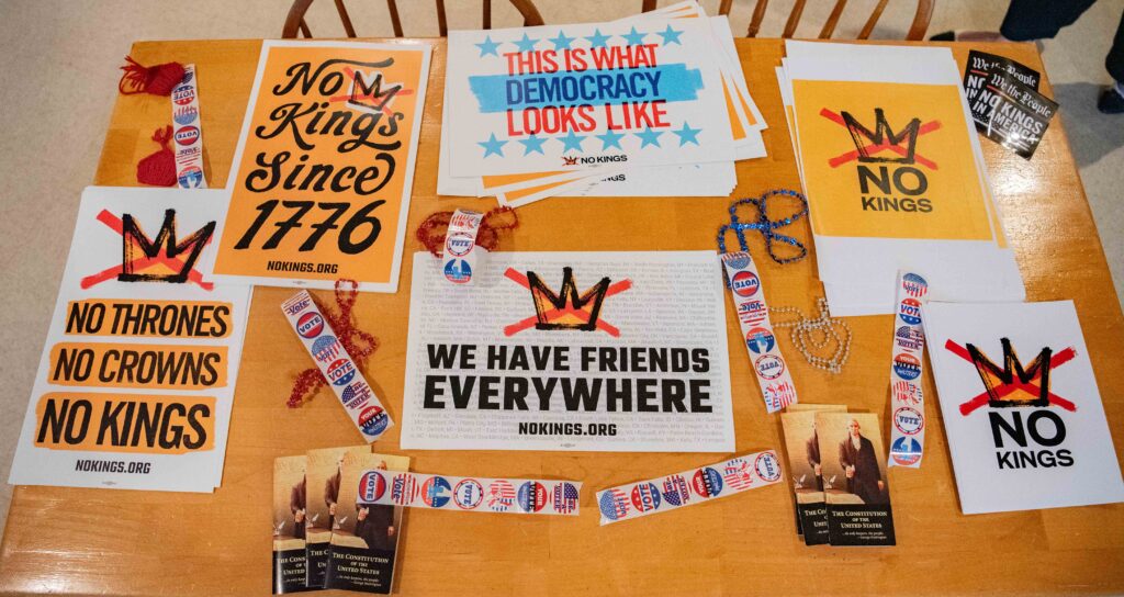 Posters on the welcome table - no kings, etc.